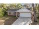 Charming single-Gathering home with a well-manicured lawn and two-car garage, perfect for suburban living at 39832 N Hibiscus Way, Lady Lake, FL 32159