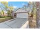 Charming home featuring a two-car garage and American flag at 39832 N Hibiscus Way, Lady Lake, FL 32159