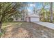 Inviting single-story home with a manicured lawn, American flag, and a two-car garage at 39832 N Hibiscus Way, Lady Lake, FL 32159
