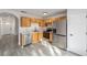 Well-equipped kitchen with stainless steel appliances, ample cabinet space, and modern countertops for culinary enthusiasts at 39832 N Hibiscus Way, Lady Lake, FL 32159