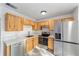 Modern kitchen featuring stainless steel appliances, plenty of cabinet space, and sleek countertops, designed for functionality and style at 39832 N Hibiscus Way, Lady Lake, FL 32159
