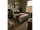 Stylish bedroom with warm tones, decorative artwork, and natural light at 774 Lobelia Dr, Davenport, FL 33837