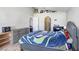 Spacious bedroom with neutral paint, arched doorways, and generous closet space at 774 Lobelia Dr, Davenport, FL 33837