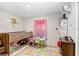 bedroom featuring colorful carpet, storage, and playful decor at 774 Lobelia Dr, Davenport, FL 33837