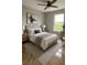 Bright bedroom featuring neutral colors, ceiling fan, and ample natural light at 774 Lobelia Dr, Davenport, FL 33837