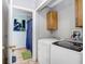 Laundry room with washer, dryer, and adjacent bathroom and shower at 774 Lobelia Dr, Davenport, FL 33837