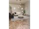 Cozy living room featuring neutral tones, recessed lighting, and a stylish ottoman at 774 Lobelia Dr, Davenport, FL 33837