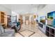 Open-concept living area with sleek tile flooring, seamlessly connecting to the kitchen for easy living at 774 Lobelia Dr, Davenport, FL 33837