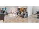 Spacious living room featuring sleek tile flooring and ample seating at 774 Lobelia Dr, Davenport, FL 33837