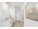 Spacious bathroom with double vanity, large mirror, and a glass-enclosed walk-in shower at 8734 Sw 55Th Street Rd, Ocala, FL 34481