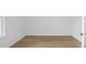 Bright bedroom with light hardwood flooring, neutral walls, and natural light from the window at 8734 Sw 55Th Street Rd, Ocala, FL 34481