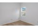 Bedroom with light hardwood flooring, neutral walls, and natural light from the window at 8734 Sw 55Th Street Rd, Ocala, FL 34481