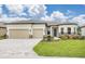 Charming single-story home with a manicured lawn, a two-car garage, and a welcoming entrance at 8734 Sw 55Th Street Rd, Ocala, FL 34481