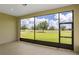 Enjoy the screened lanai views of the lush green lawn and distant trees at 8734 Sw 55Th Street Rd, Ocala, FL 34481