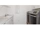 Laundry room featuring modern washer and dryer, ample counter space, and a sink at 8734 Sw 55Th Street Rd, Ocala, FL 34481