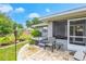 Relaxing backyard with a hot tub, patio area, and landscaping at 1007 Cr 463B, Lake Panasoffkee, FL 33538