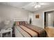 Well-lit bedroom featuring a ceiling fan, queen size bed, and neutral wall color at 1007 Cr 463B, Lake Panasoffkee, FL 33538