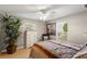 Bedroom with a ceiling fan, hardwood floors, neutral paint and bright natural light at 1007 Cr 463B, Lake Panasoffkee, FL 33538