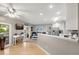Bright living room view flowing to kitchen, featuring stainless steel appliances at 1007 Cr 463B, Lake Panasoffkee, FL 33538