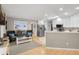 Open-concept living room flows into the kitchen with stainless steel appliances at 1007 Cr 463B, Lake Panasoffkee, FL 33538