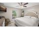 Bright main bedroom with accent wall, plush headboard, and large window view at 1007 Cr 463B, Lake Panasoffkee, FL 33538