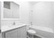 Bathroom showcasing a tiled tub/shower combination, sink and modern fixtures at 13284 Tula Loop, Astatula, FL 34705