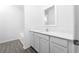 Bright bathroom showcases a modern vanity, mirror, and a shower/tub with white tile at 13442 Leaping Water Way, Astatula, FL 34705