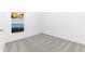 The vacant bedroom with neutral colored carpet with a single window at 13442 Leaping Water Way, Astatula, FL 34705