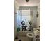 Small bathroom with a tub, shower, and toilet at 504 Sears Ne Ave, Winter Haven, FL 33881