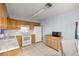 Bright kitchen features wooden cabinets and stainless steel appliances at 5728 Ne 21St Avenue Rd, Ocala, FL 34479