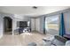 A bright and airy living room features tiled floors and neutral paint at 5728 Ne 21St Avenue Rd, Ocala, FL 34479