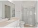 Bright bathroom with a clear glass shower, vanity with undermount sink, and modern fixtures at 8787 Sw 52Nd Place Rd, Ocala, FL 34481