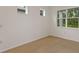 Bedroom with tile floors, base molding, neutral walls, and natural light at 8787 Sw 52Nd Place Rd, Ocala, FL 34481