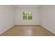 Bedroom with tile floors, base molding, neutral walls, and natural light at 8787 Sw 52Nd Place Rd, Ocala, FL 34481