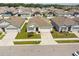 This aerial view reveals a well-maintained home nestled in a serene neighborhood with manicured lawns and ample space at 879 Killarney Ln, Auburndale, FL 33823