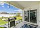 The well-maintained backyard features a grill, stepping stones, and a lush lawn, ideal for outdoor gatherings at 879 Killarney Ln, Auburndale, FL 33823