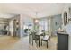 Bright dining room with sliding glass doors leading to outdoor patio and backyard at 879 Killarney Ln, Auburndale, FL 33823