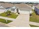 This beautiful single-Gathering home features a well-manicured lawn, a two-car garage, and a charming entryway at 879 Killarney Ln, Auburndale, FL 33823