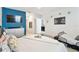 Spacious main bedroom with blue accent wall and an ensuite bathroom at 879 Killarney Ln, Auburndale, FL 33823