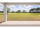 Expansive backyard view overlooking the lush green golf course and beautiful neighboring houses on a sunny day at 8980 Sw 52Nd Place Rd, Ocala, FL 34481