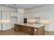 Modern kitchen featuring white cabinets, an island with a sink, and stainless steel appliances at 8980 Sw 52Nd Place Rd, Ocala, FL 34481
