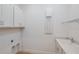 Laundry room with sink, white cabinets, and quartz countertops at 8980 Sw 52Nd Place Rd, Ocala, FL 34481