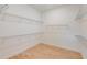 Spacious walk-in closet with wire shelving and wood-look flooring at 8980 Sw 52Nd Place Rd, Ocala, FL 34481