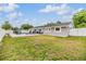 Expansive backyard features a pool and patio seating area at 4523 Oakglen Rd, Lakeland, FL 33813