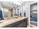 Bathroom features double vanity with granite countertop and a walk-in shower at 4523 Oakglen Rd, Lakeland, FL 33813