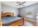 Bedroom offers a bright window with hardwood floors at 4523 Oakglen Rd, Lakeland, FL 33813