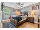 Bedroom boasts hardwood floors and a large window at 4523 Oakglen Rd, Lakeland, FL 33813