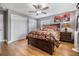 Bedroom features hardwood floors and a large closet at 4523 Oakglen Rd, Lakeland, FL 33813