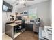 Well-lit home office with a large desk and plenty of workspace at 4523 Oakglen Rd, Lakeland, FL 33813