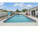 Private pool with basketball hoop adjacent to the home's patio at 4523 Oakglen Rd, Lakeland, FL 33813